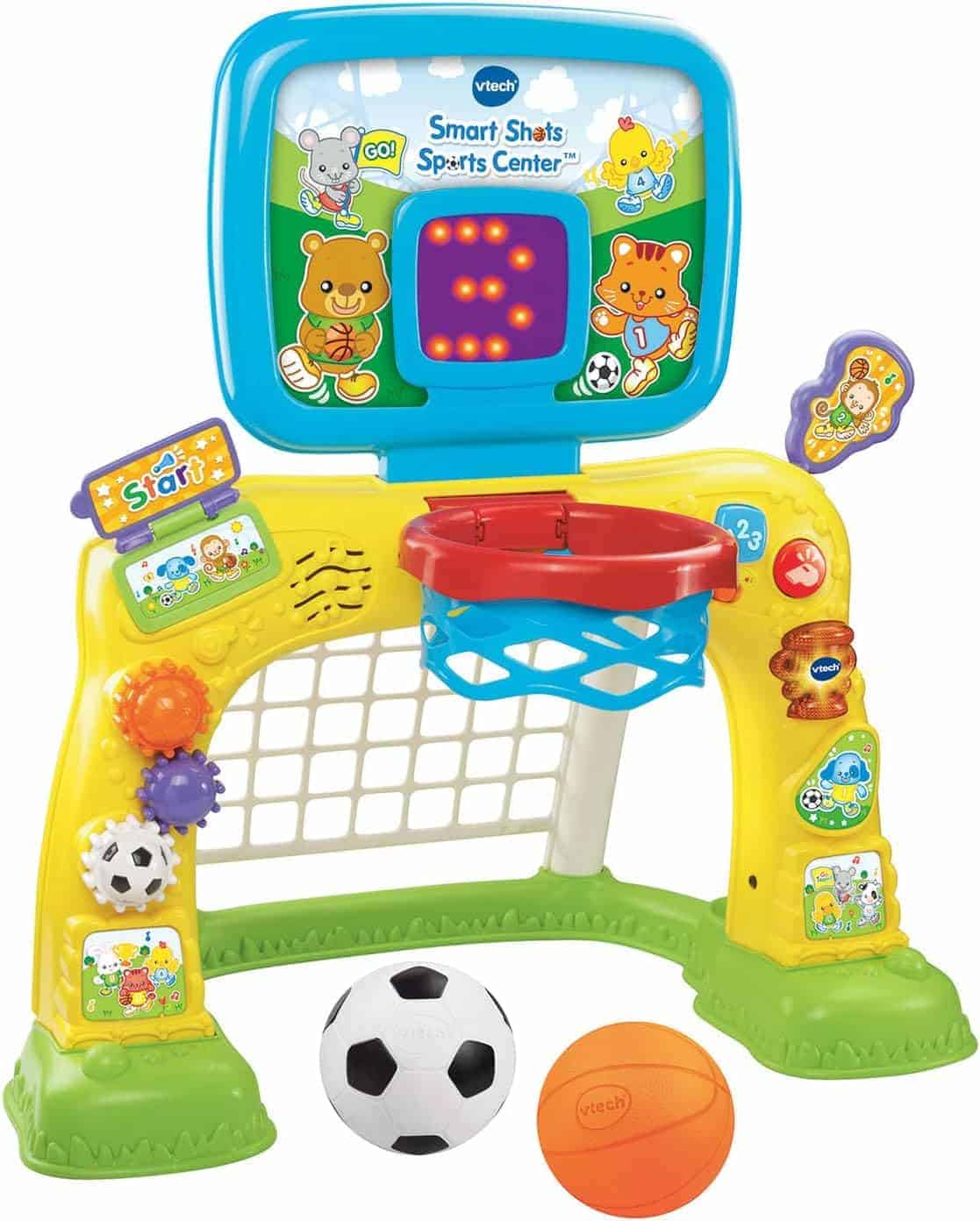Colorful VTech Smart Shots Sports Center featuring a basketball hoop, soccer net, interactive scoreboard, and two balls, one soccer and one basketball, placed in front.