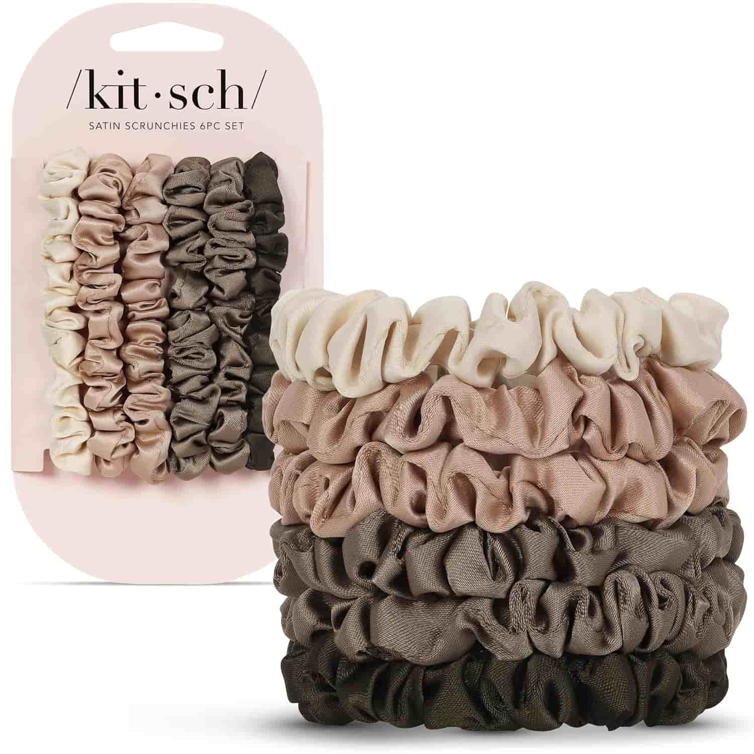 A set of four satin scrunchies in shades of cream, taupe, and brown, displayed on a packaging card labeled "kitsch.