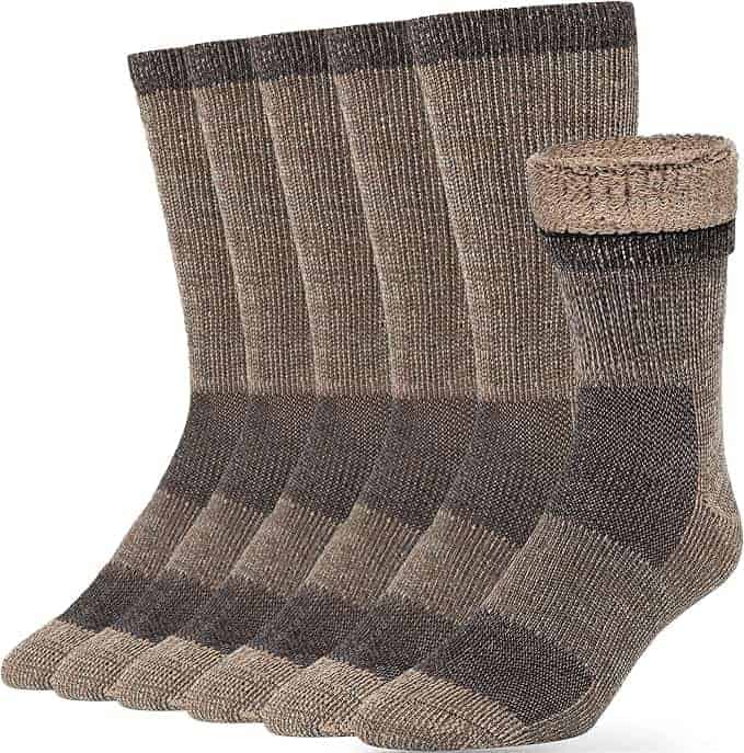 A set of six pairs of brown and beige crew socks with reinforced toes and heels, arranged in a row with one pair rolled at the top.