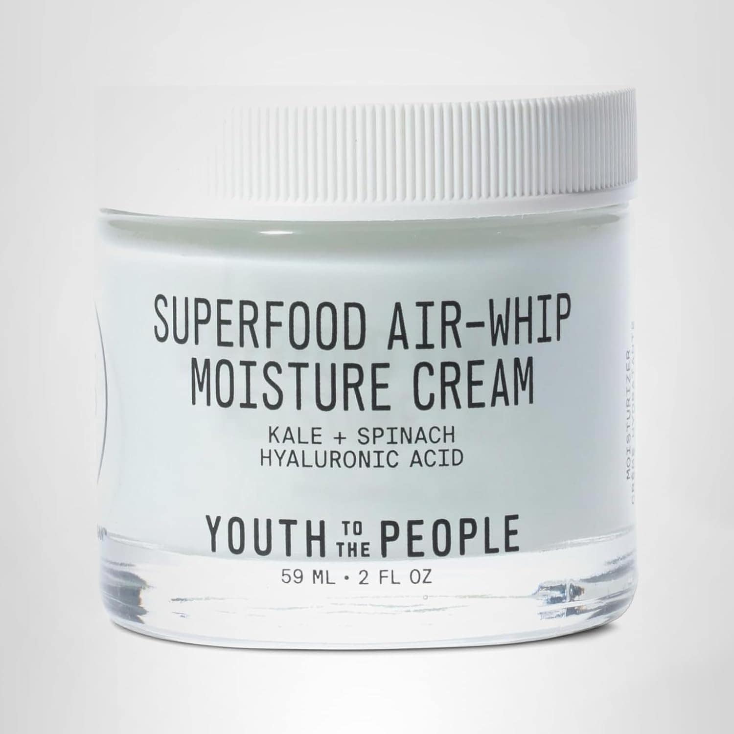 A glass jar of Superfood Air-Whip Moisture Cream by Youth to the People, labeled with ingredients kale, spinach, and hyaluronic acid.