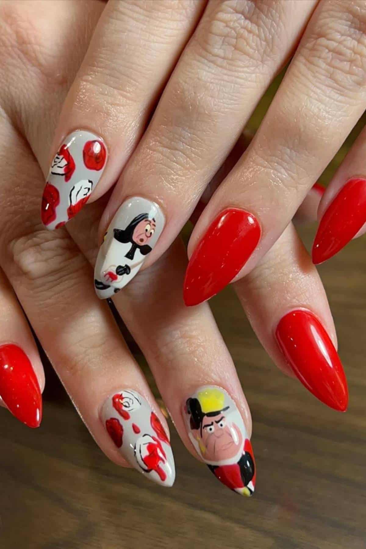 Hands with almond-shaped nails painted red; two nails feature cartoon character and rose designs on a neutral base.