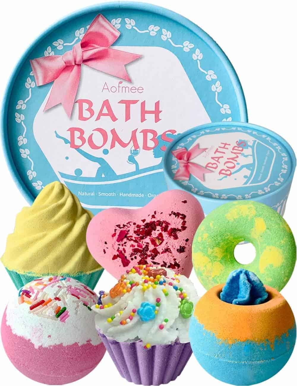 A variety pack of colorful bath bombs in different shapes and designs is displayed in front of a blue round gift box labeled "Aofmee Bath Bombs.