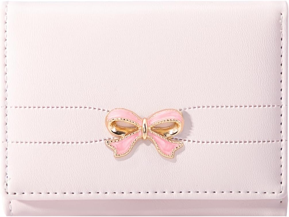A light pink wallet with a stitched pattern and a decorative gold and pink bow clasp on the front.
