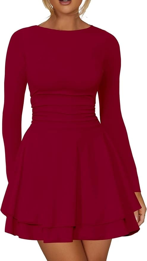 Woman wearing a long-sleeve, fitted burgundy dress with a cinched waist and a flared, layered skirt.