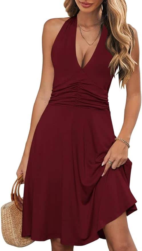 Women's stylish V-neck burgundy midi dress with ruched waist and flowy skirt. Perfect for summer and casual occasions.