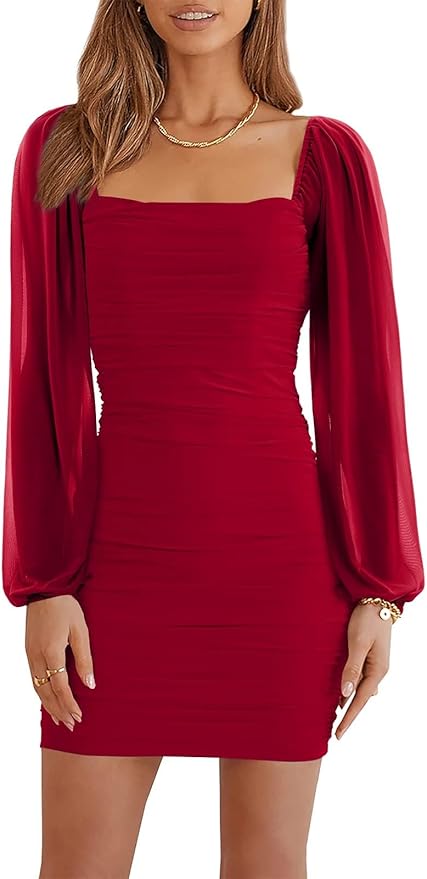 Woman wearing a fitted red mini dress with long, sheer puff sleeves, a square neckline, and ruched detailing, accessorized with a gold necklace and bracelet.