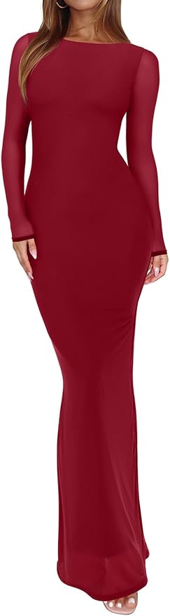 A woman wearing a long-sleeved, floor-length, fitted burgundy dress, standing with her hands at her sides.