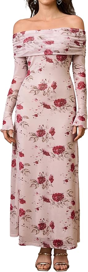 Woman wearing a long, off-shoulder pink dress with red floral prints, long sleeves, and sandals.