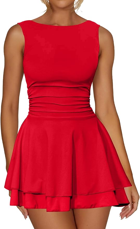 Woman wearing a sleeveless, fitted red dress with a ruched waist and a layered, flared skirt.
