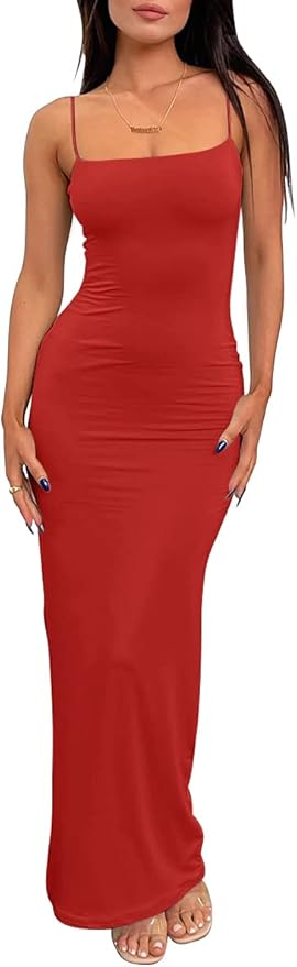 Woman wearing a sleeveless, form-fitting red maxi dress with spaghetti straps, standing with hands by her sides and wearing sandals.