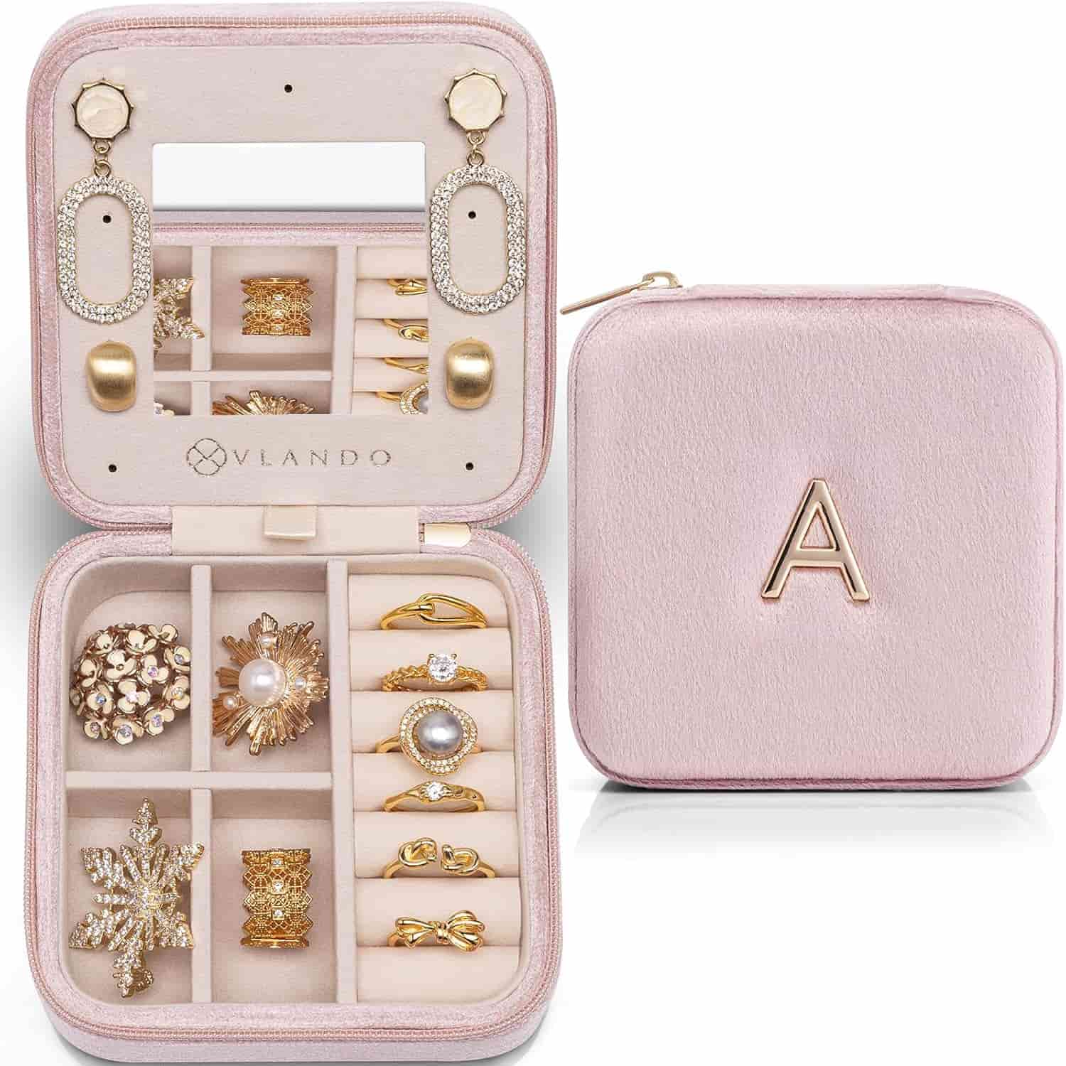 A jewelry box with gold jewelry in it.