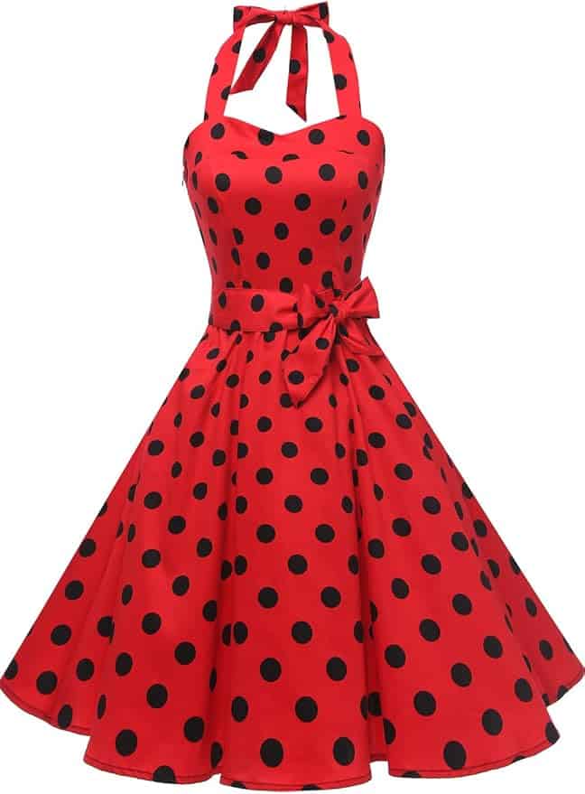 A sleeveless, red halter-neck dress with a flared skirt and black polka dots, featuring a bow at the waist.