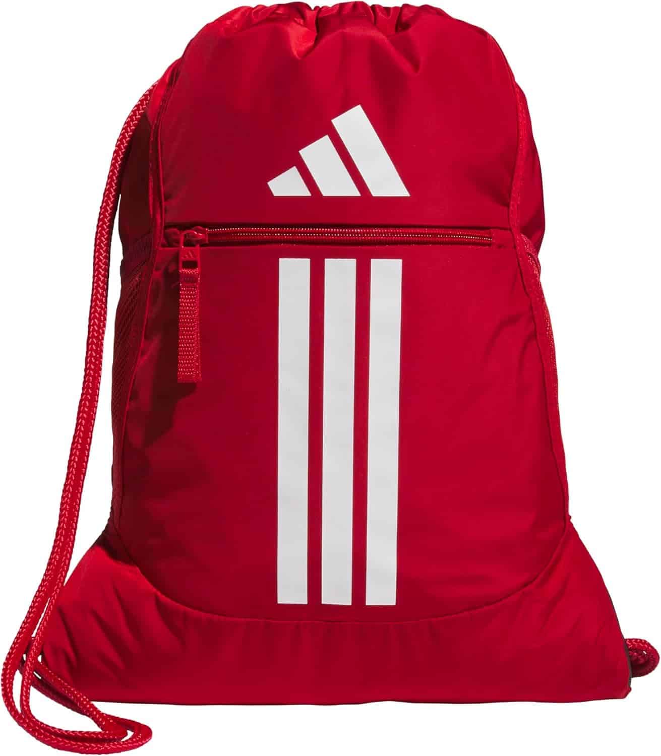 A red drawstring backpack with a front zipper pocket and white Adidas logo and three stripes on the front.