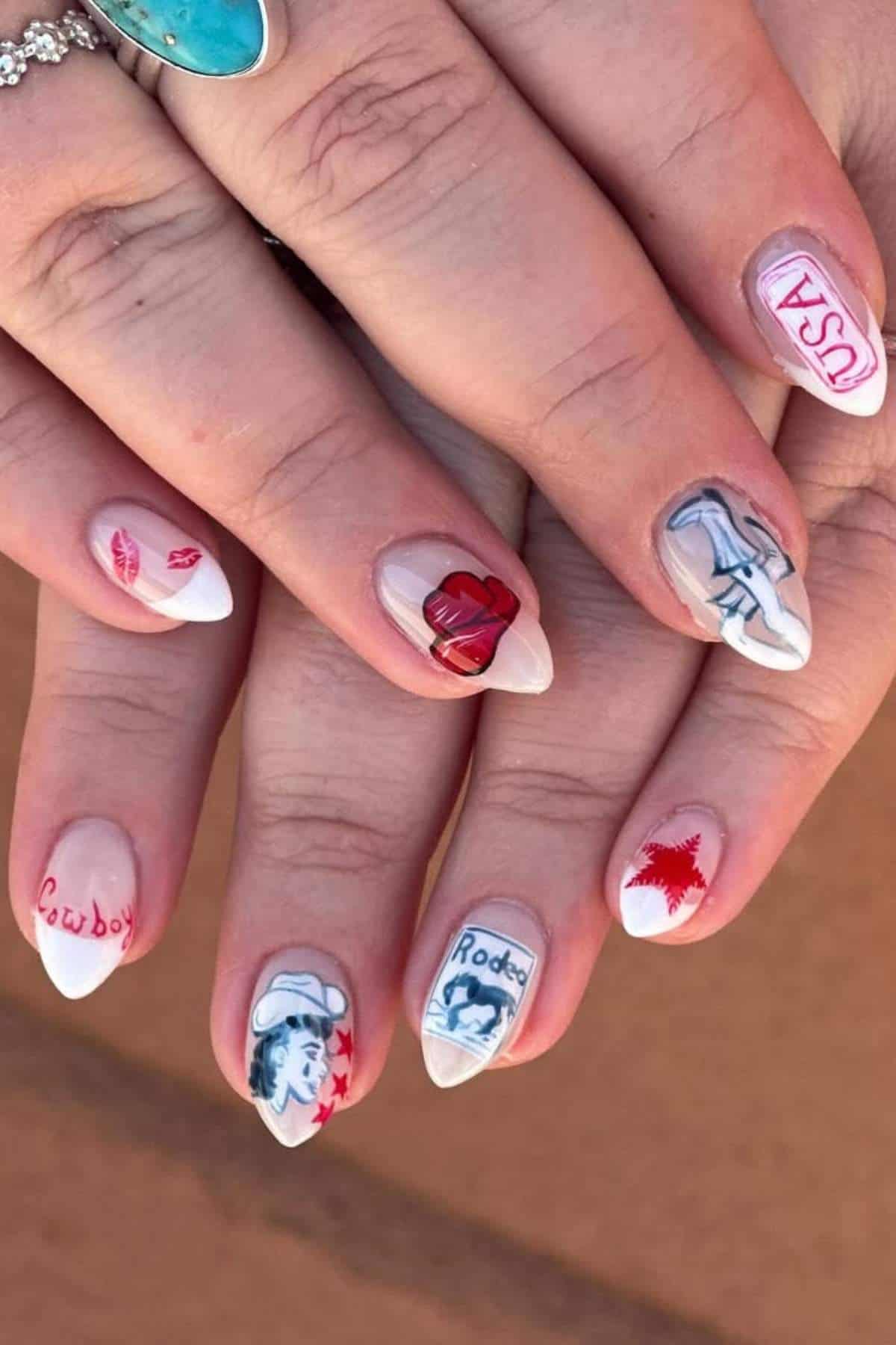 Hands with long, pointed nails featuring western-themed nail art, including cowboy hats, horses, stars, hearts, and the words “Cowboy,” “Rodeo,” and “USA.”.