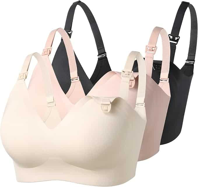 Three seamless nursing bras in beige, pink, and black with adjustable straps and clip-down cups are displayed in a row.