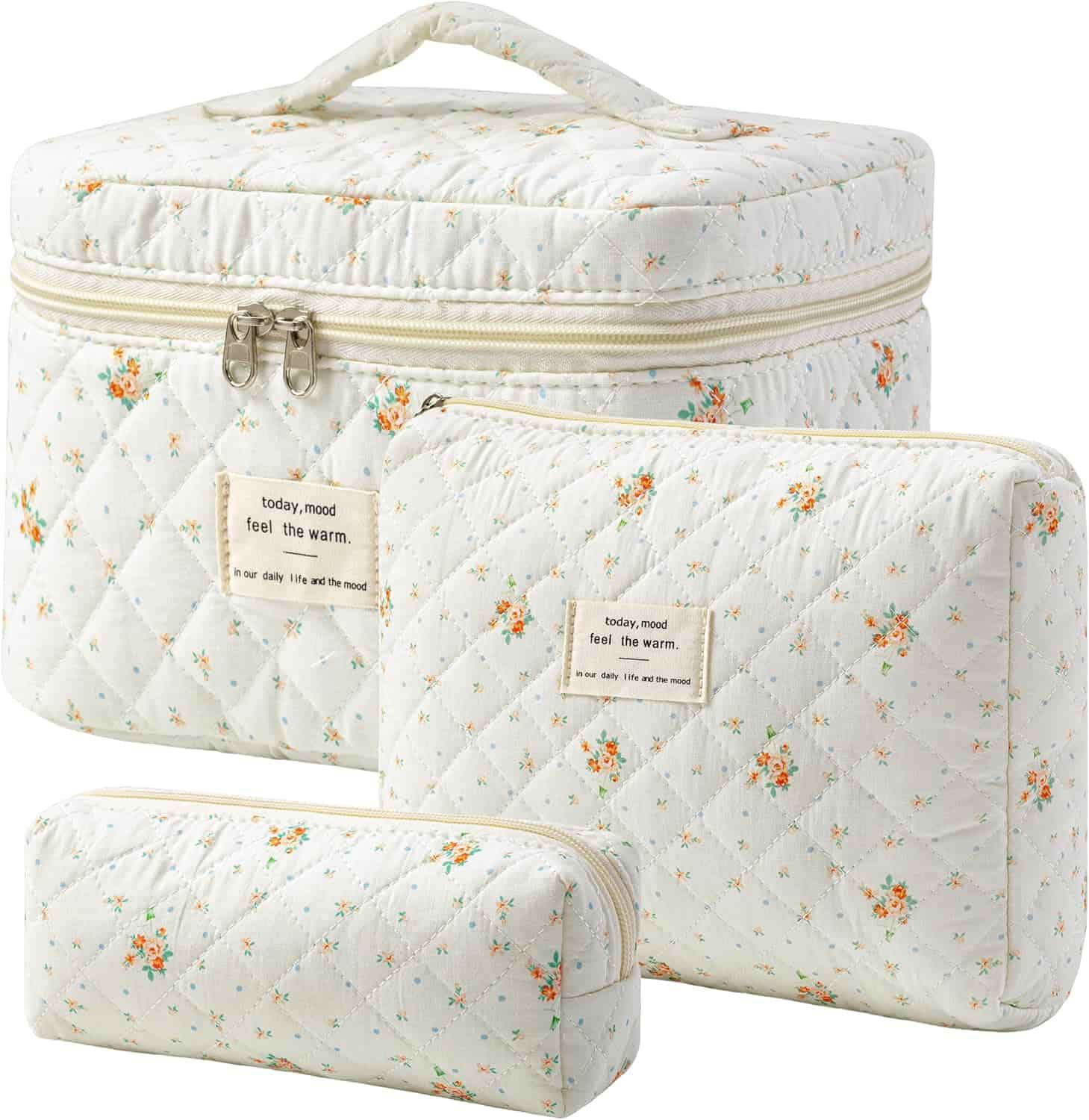 Three quilted, floral-patterned cosmetic bags with zippers are stacked together, each featuring a small label that reads "today, mood feel the warm.