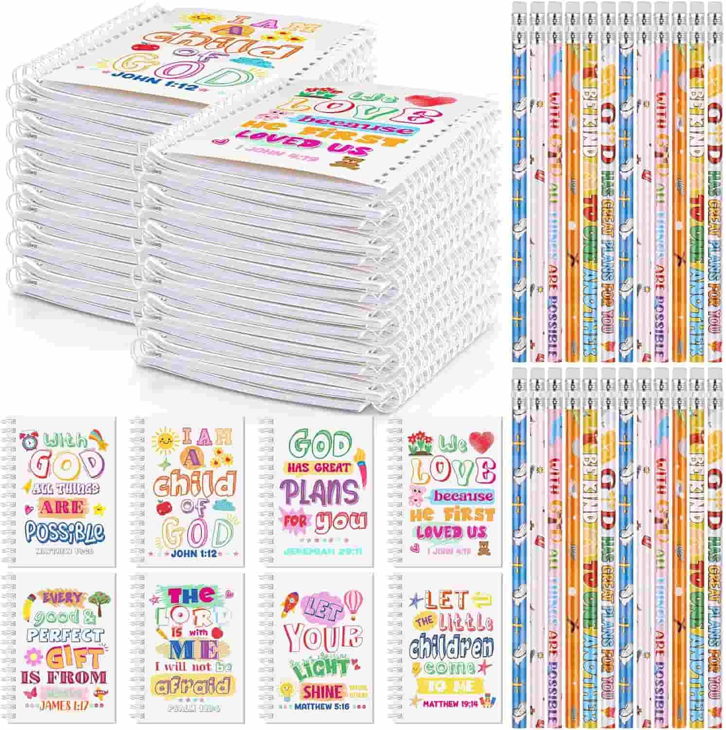 A set of spiral notebooks, colorful pencils, and cards featuring inspirational Bible verses and positive messages displayed in an organized arrangement.