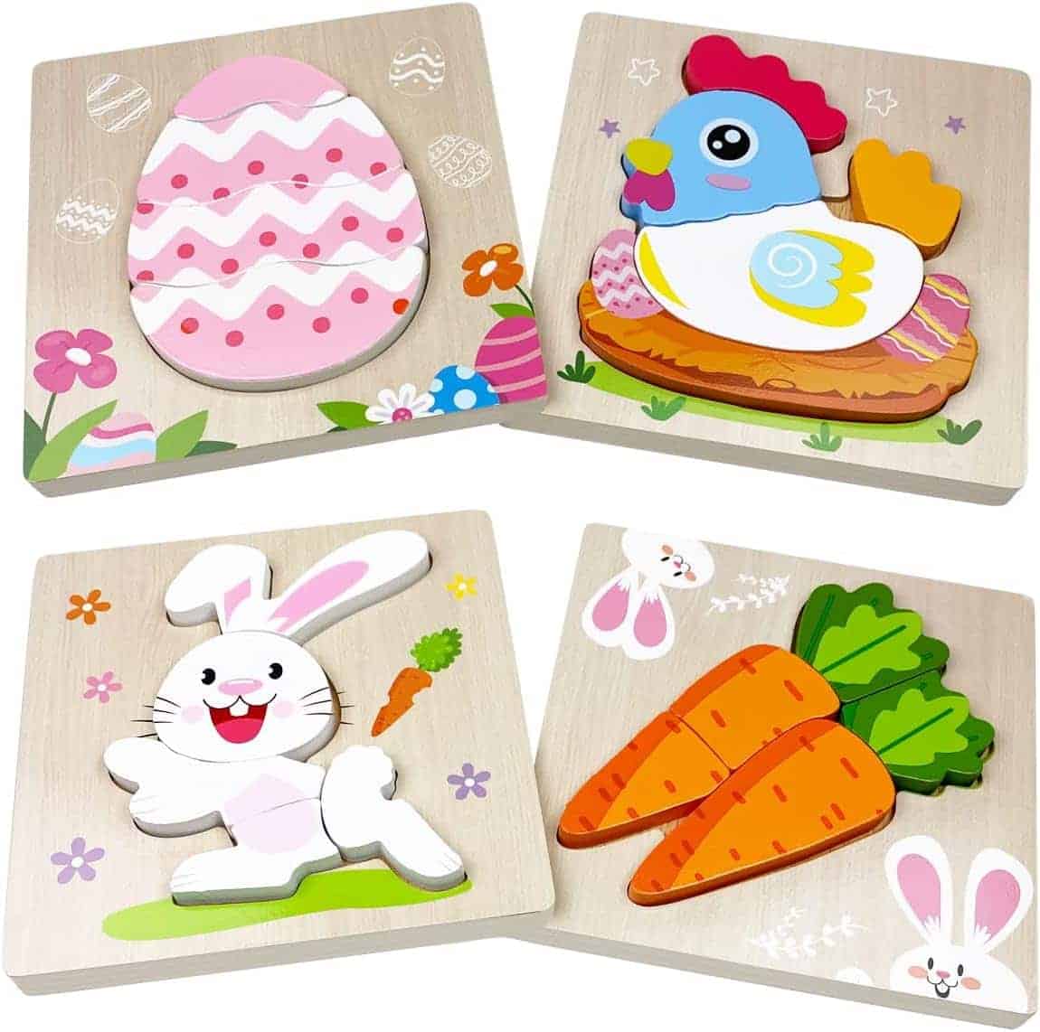 Four wooden puzzle boards featuring illustrations of an Easter egg, a chicken, a white bunny, and two orange carrots with green tops.
