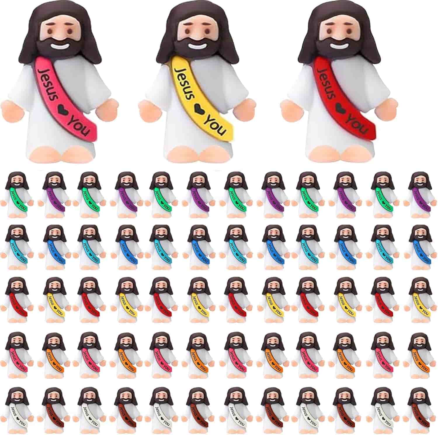 A collection of small Jesus figurines in white robes with sashes in various colors that read "Jesus ♥ You," arranged in rows.