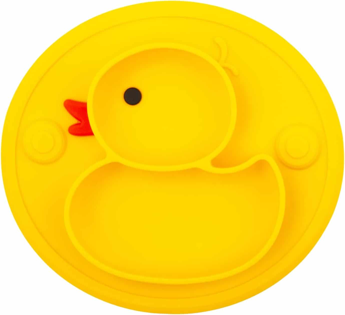 A yellow silicone plate shaped like a duck with compartments, featuring a black eye and an orange beak.