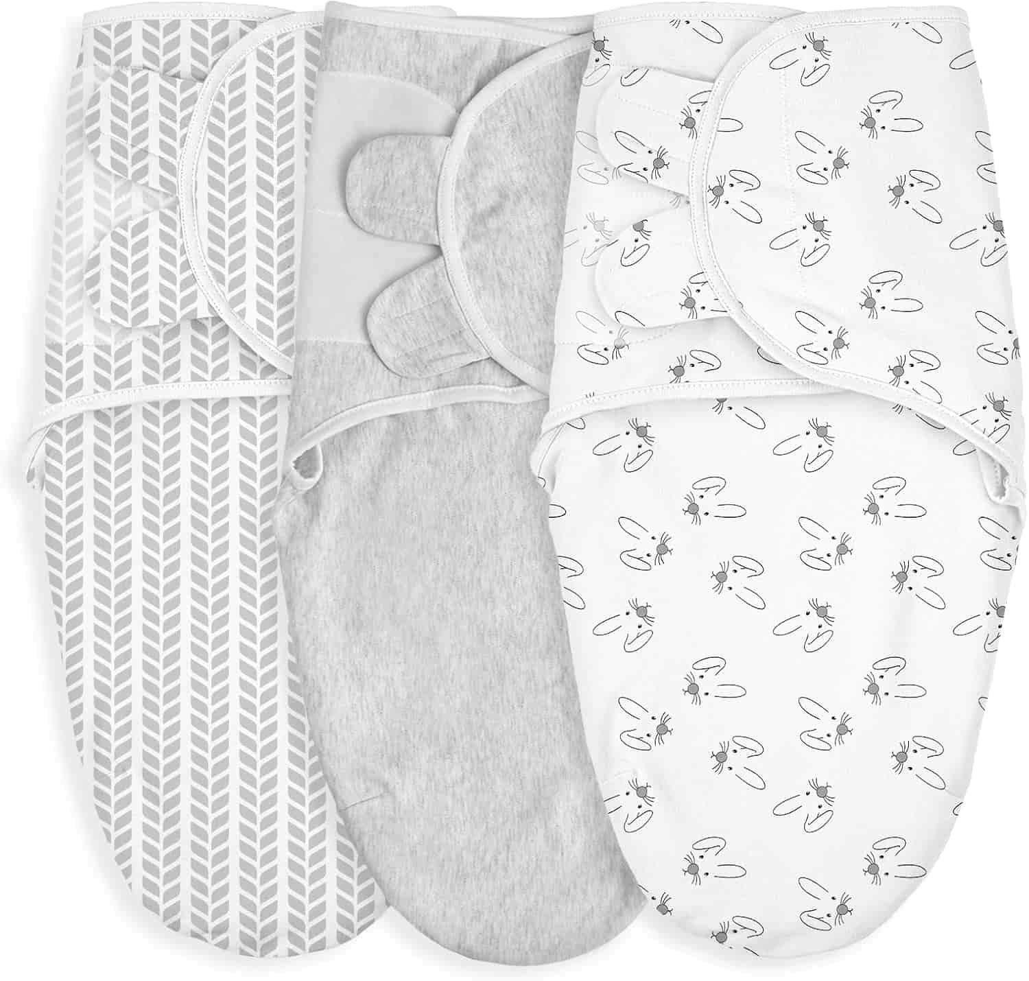 Three baby swaddle blankets are displayed side by side with different patterns: gray chevron, solid gray, and white with bunny and star illustrations.