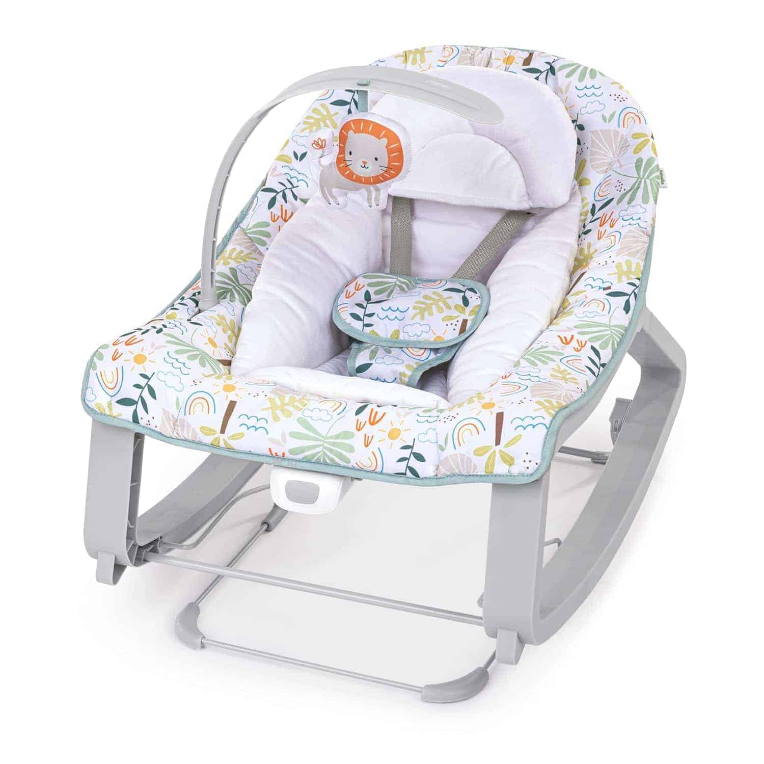 A baby rocker with a jungle-themed print, a padded seat, safety straps, a headrest, and a toy bar with a lion motif, set on a gray rocking frame.
