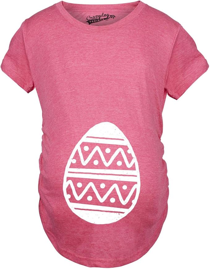 Pink maternity T-shirt with a white Easter egg graphic centered on the belly area.