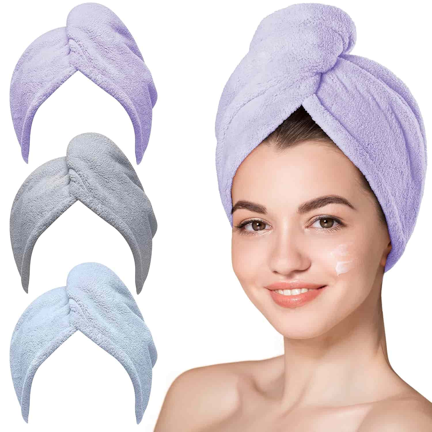 A woman with a towel wrapped around her head, smiling; three additional towels in light purple, gray, and light blue are shown beside her.