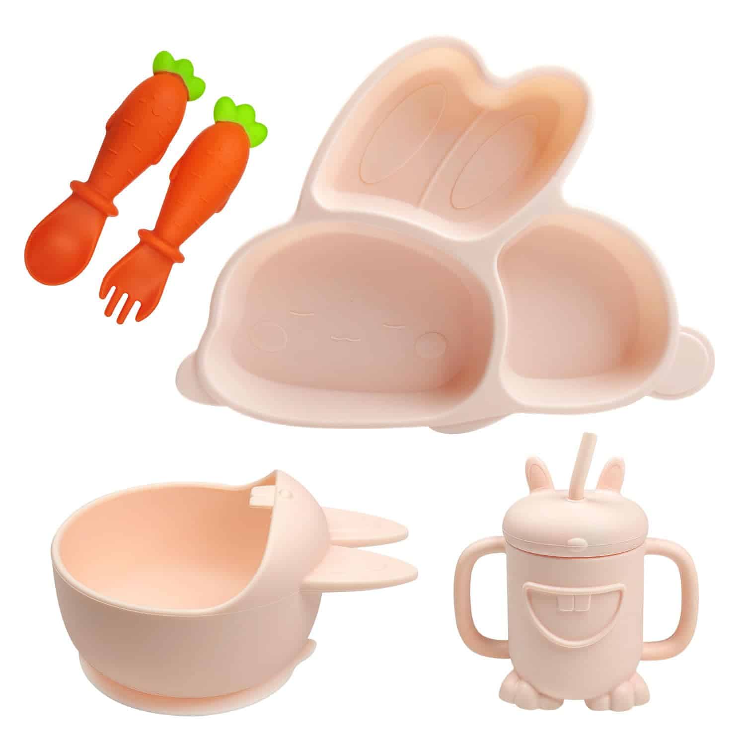 Set of children's tableware includes a bunny-shaped divided plate, bowl with bunny ears, carrot-shaped fork and spoon, and a lidded cup with handles and straw, all in pastel colors.