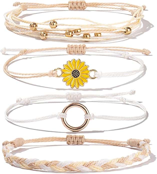 Five beige and white string bracelets are shown, each with a different design including beads, a sunflower charm, a gold ring, and a braided pattern.