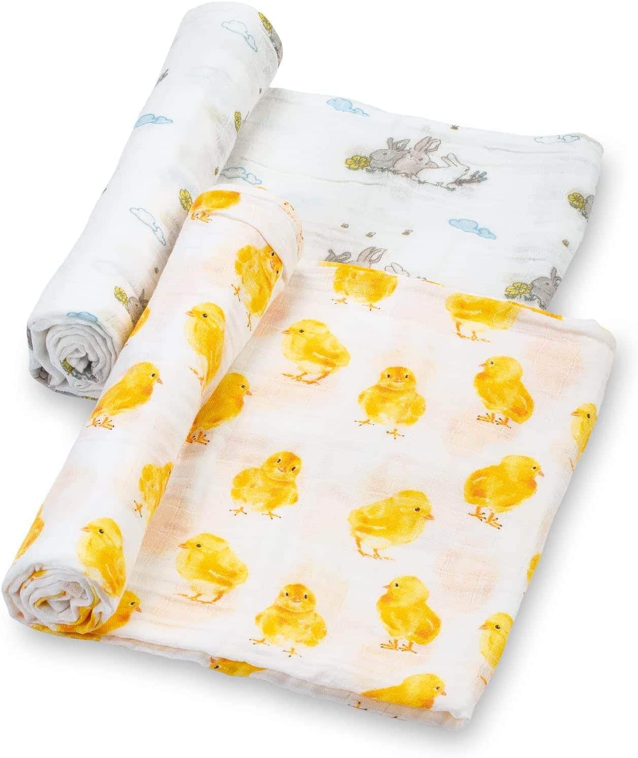 Three muslin baby swaddle blankets, two with yellow chick patterns and one with a bunny and cloud design, are laid out and partially rolled.