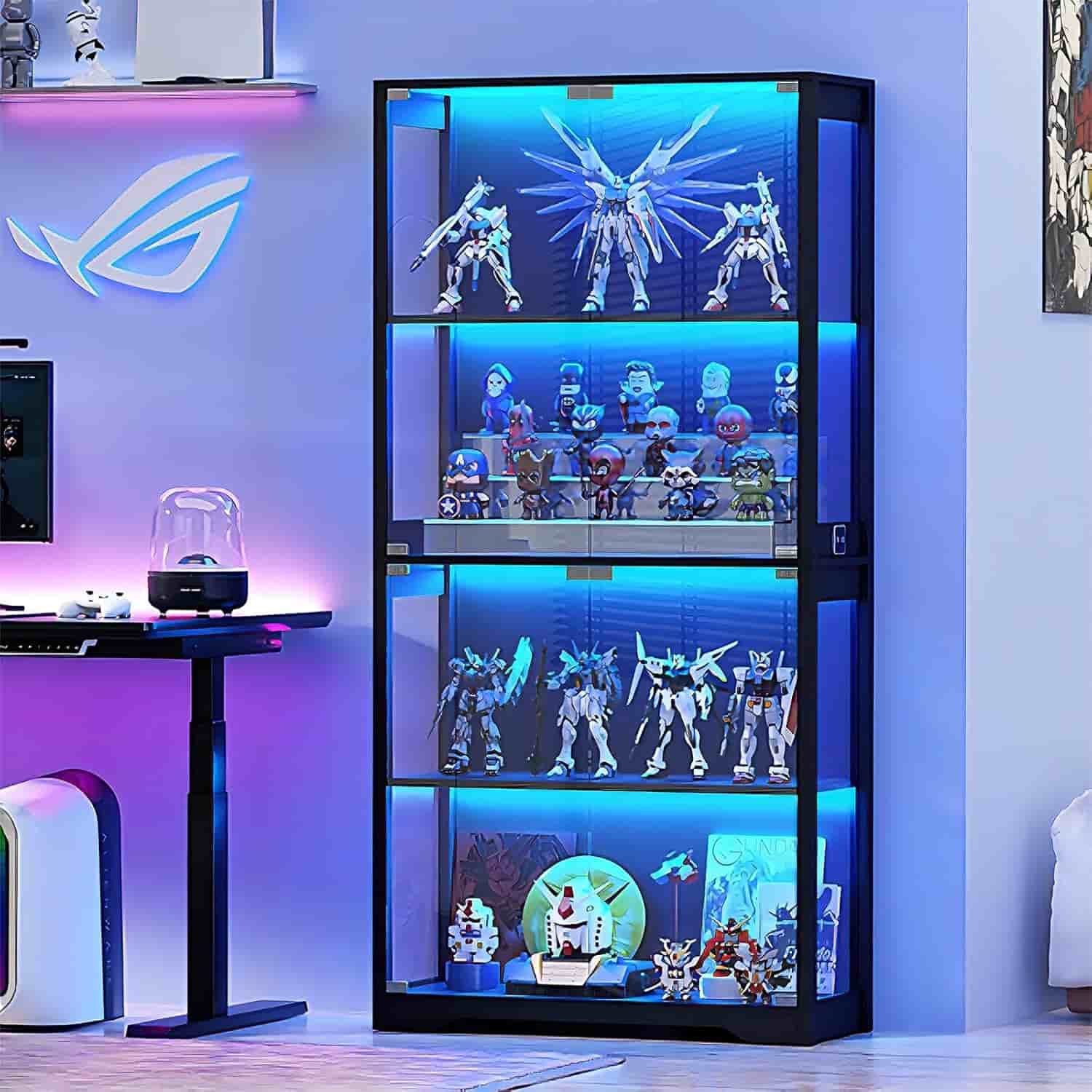 A black display cabinet with blue LED lighting showcases various anime figures, model robots, and collectibles in a modern room with a gaming setup.