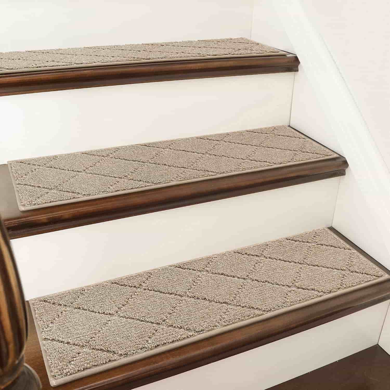 Three wooden stairs with light brown textured carpet treads and white risers, viewed at an angle from the side.