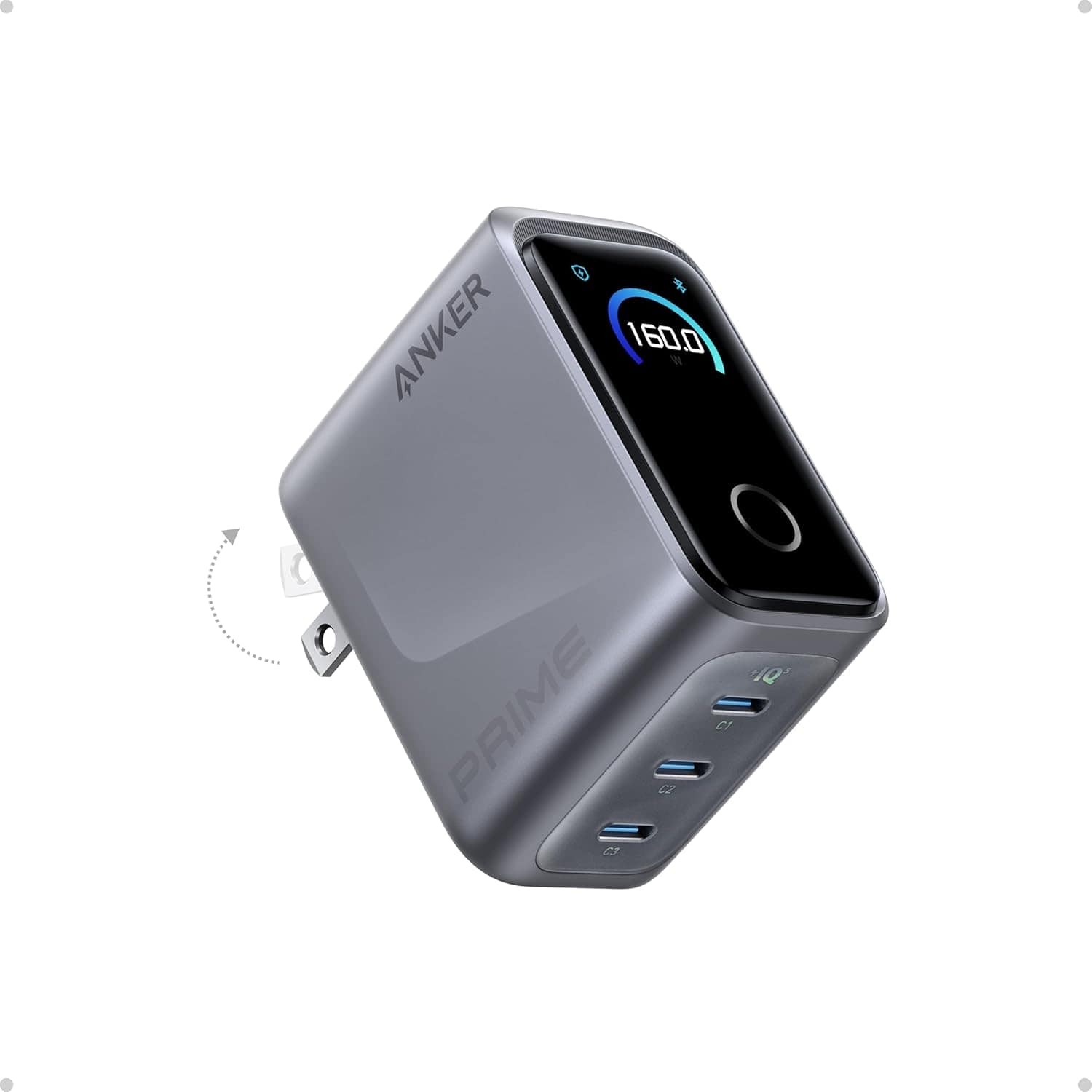 A gray Anker Prime charger with a display screen, foldable plug, and three USB ports shown at an angled view.