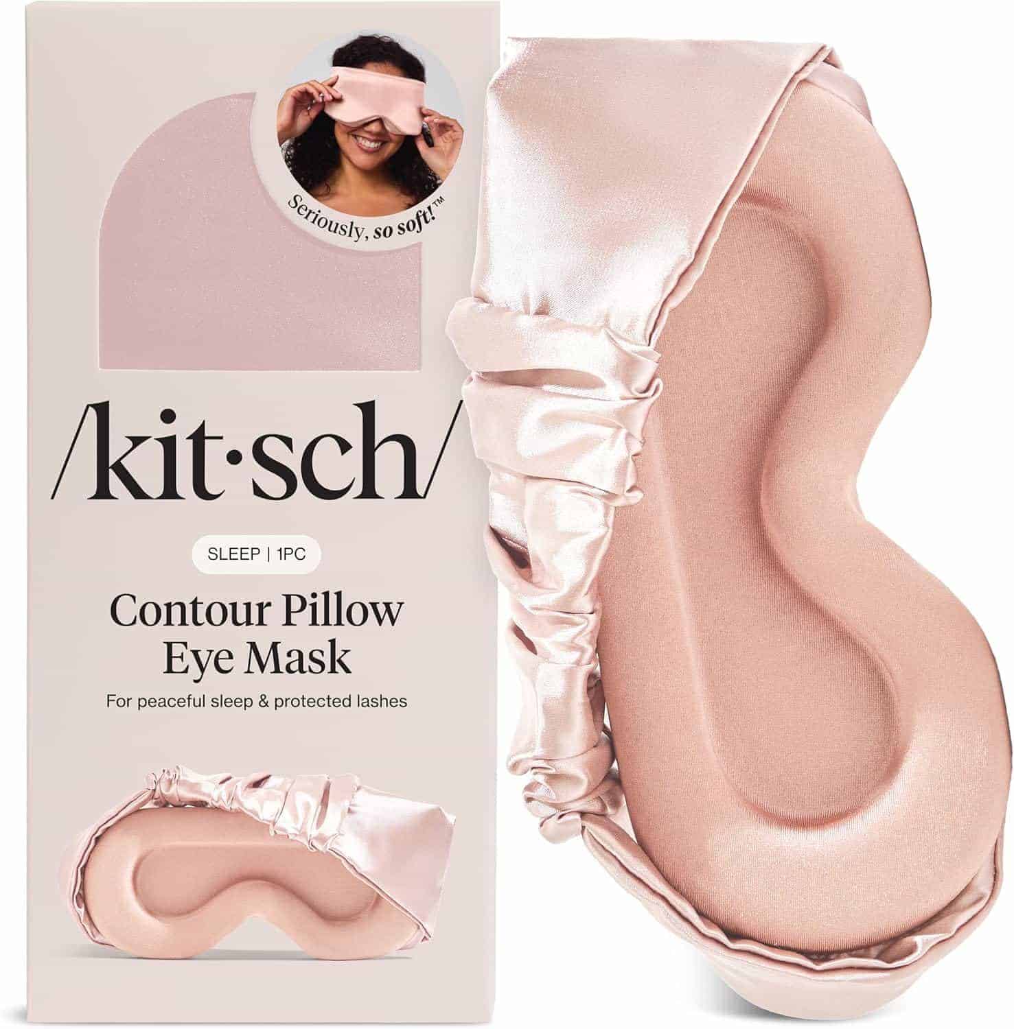 A light pink satin contour pillow eye mask is shown next to its packaging, which features the brand name “Kitsch” and highlights its soft texture and protective design.