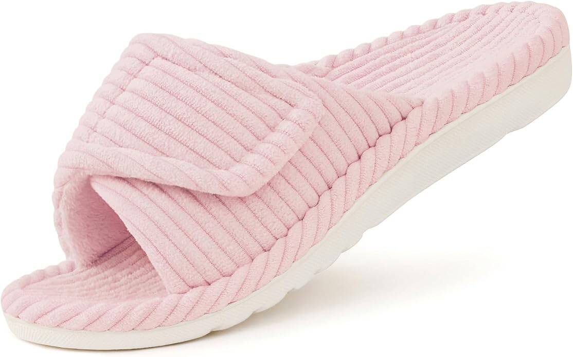 A single light pink, open-toe slipper with a ribbed texture and white sole, displayed on a white background.