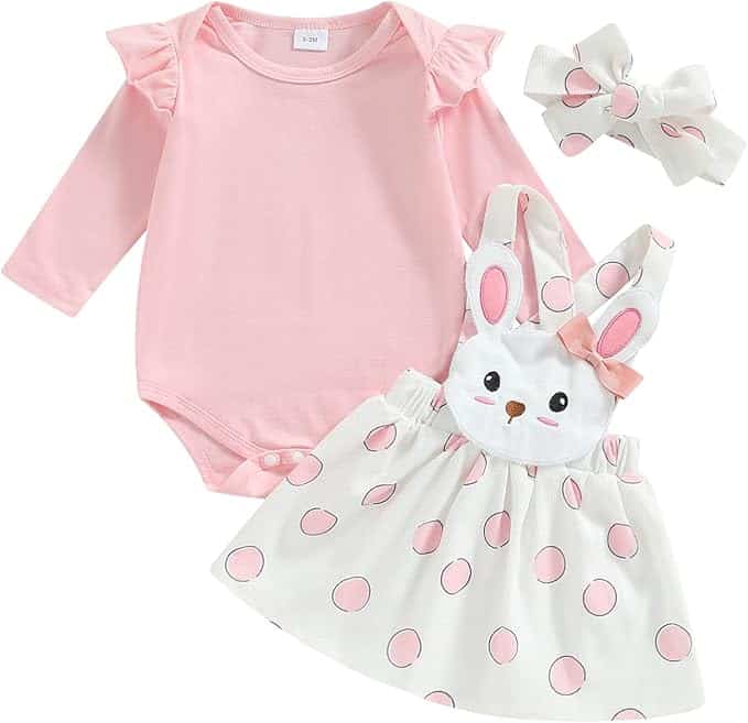Three-piece baby outfit set with a pink long-sleeve bodysuit, white polka-dot jumper dress with a bunny face, and a matching white headband with a bow.