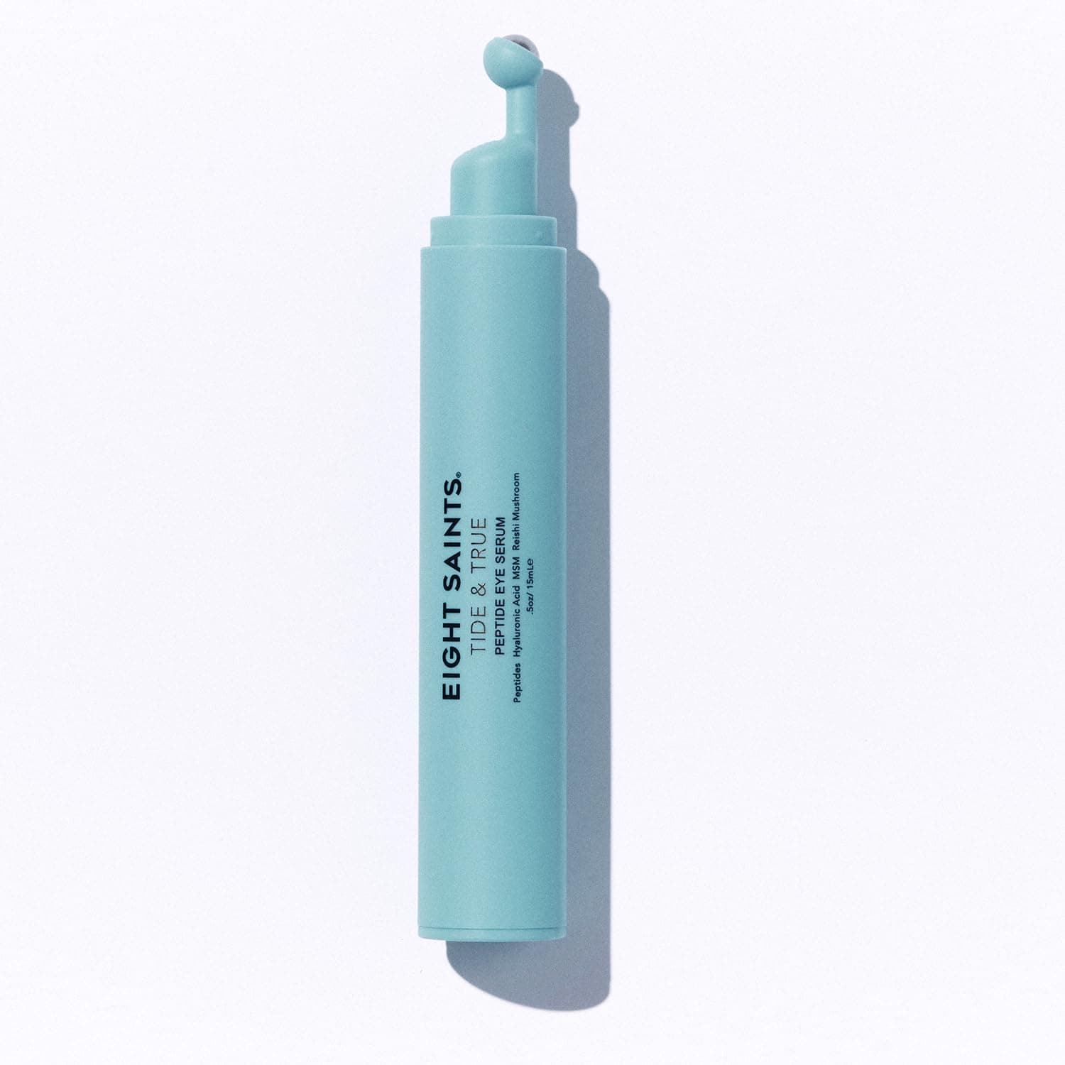 A turquoise tube labeled "EIGHT SAINTS: TRUE & TRUE" with an applicator tip, photographed on a white background.