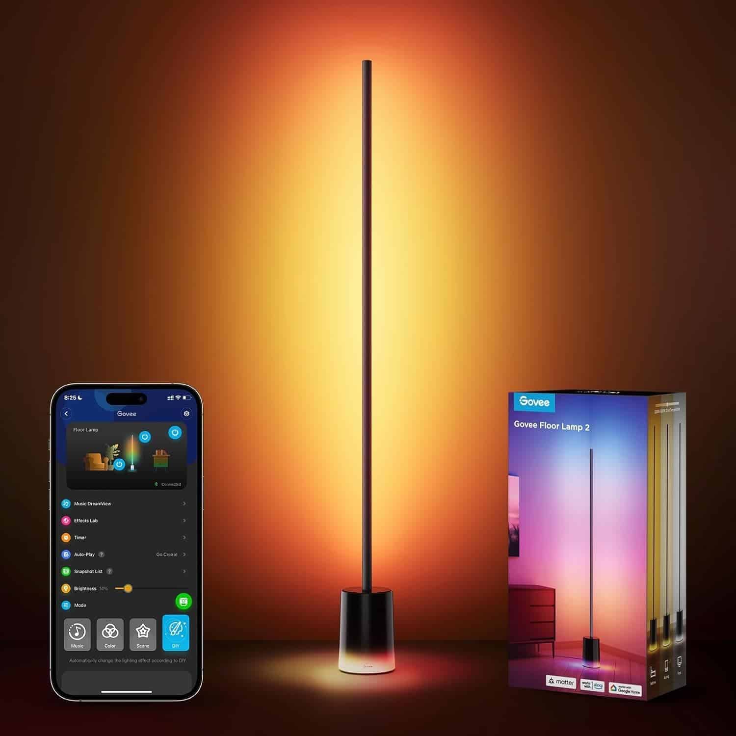 A tall, slender floor lamp emits multicolored light against a wall, with a smartphone displaying its control app and the lamp's packaging box beside it.