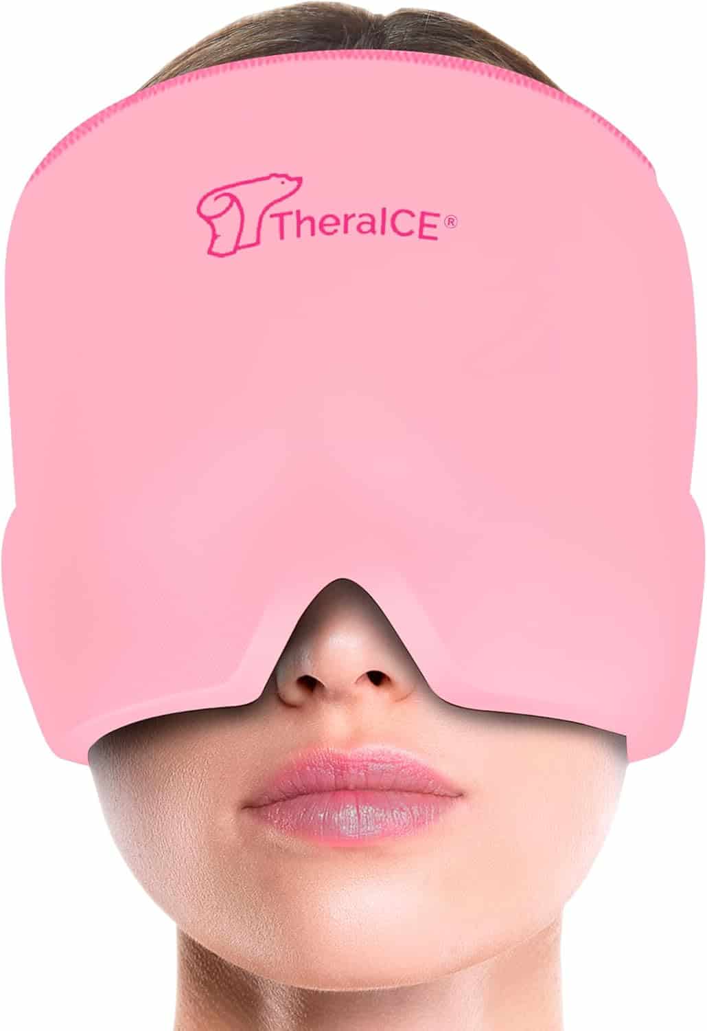 A woman wearing a pink TheraICE mask that covers her eyes, nose, and forehead, leaving her mouth exposed.