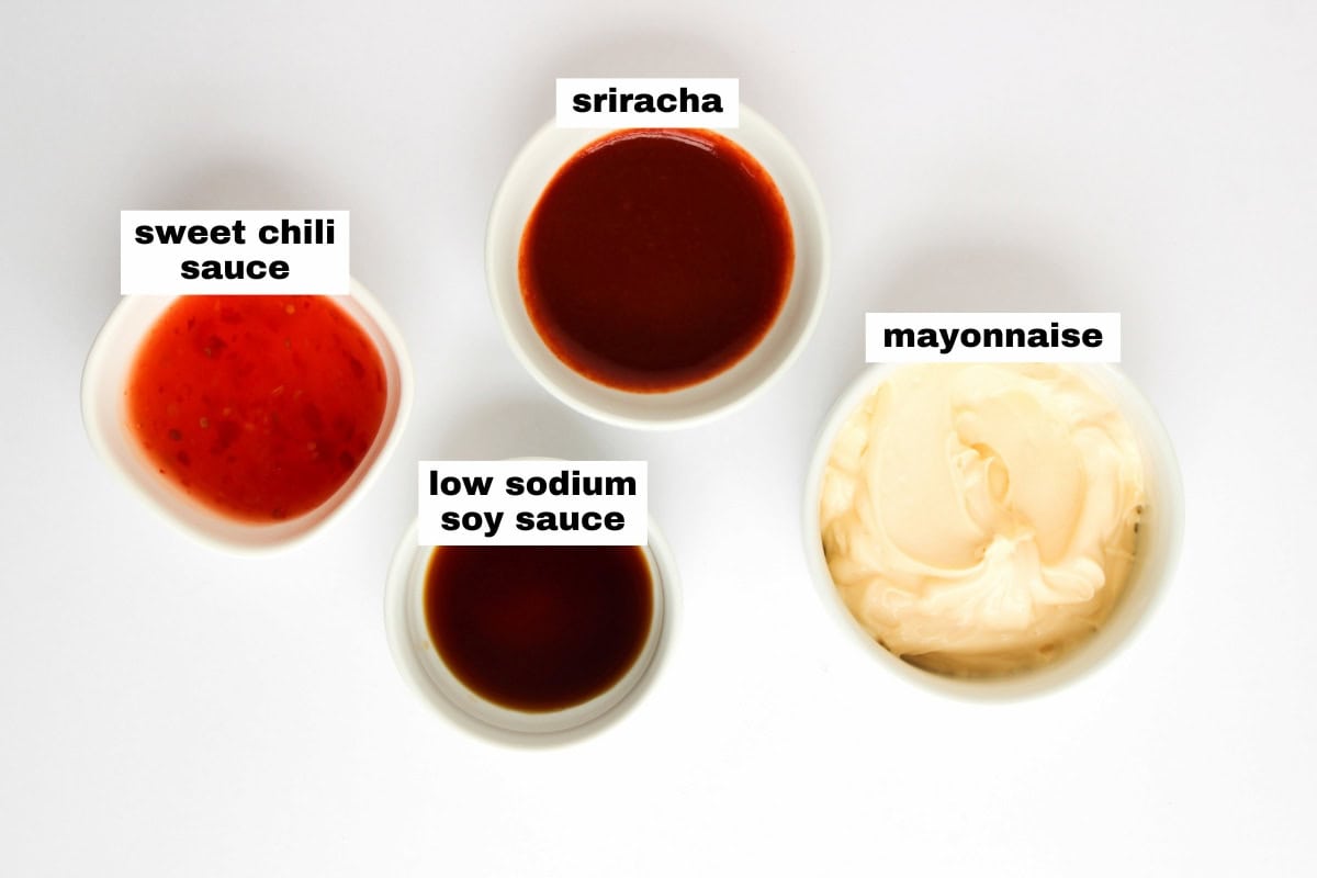 Four small bowls containing sweet chili sauce, low sodium soy sauce, sriracha, and mayonnaise, each labeled with text within the image.