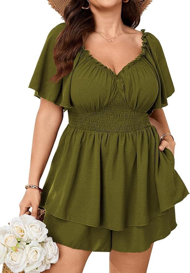 Woman wearing an olive green short-sleeve romper with a smocked waist and ruffled hem, holding a bouquet of white roses and a straw hat.