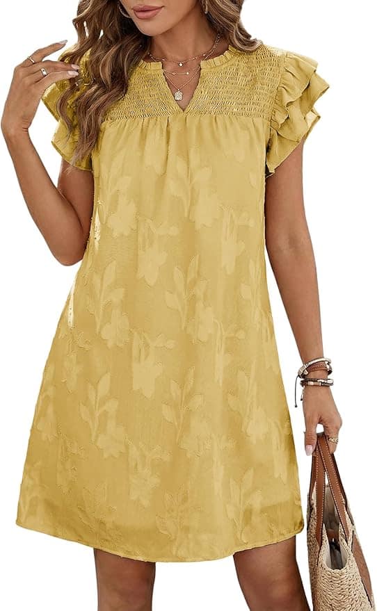 Woman wearing a short-sleeved, yellow floral dress with ruffled sleeves, holding a woven bag and accessorized with bracelets.