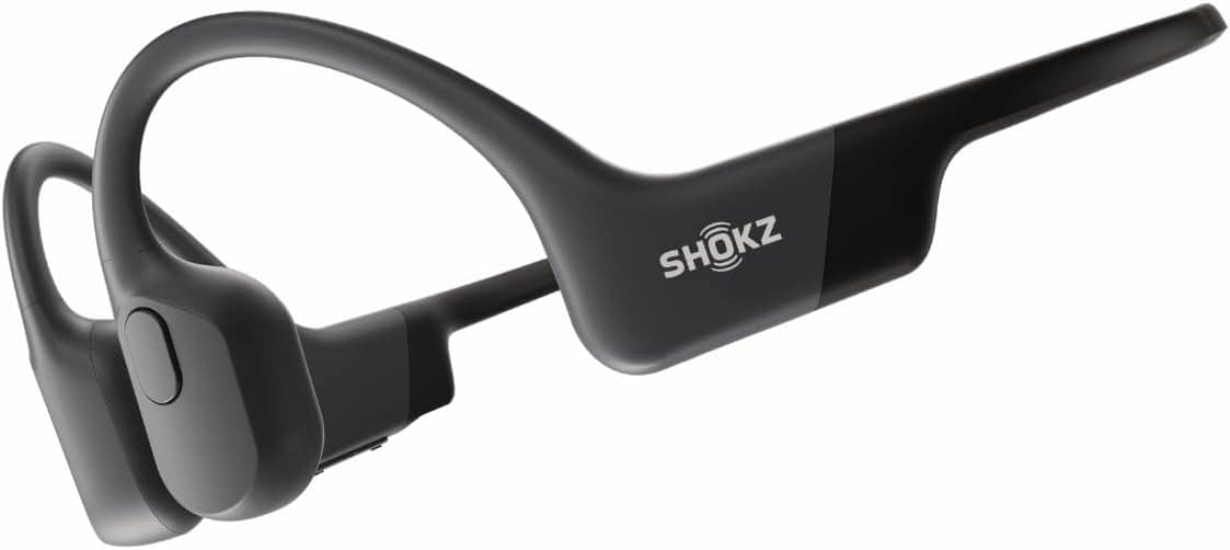 Black Shokz bone conduction headphones with an open-ear design, featuring a wraparound band and the brand logo visible on the side.