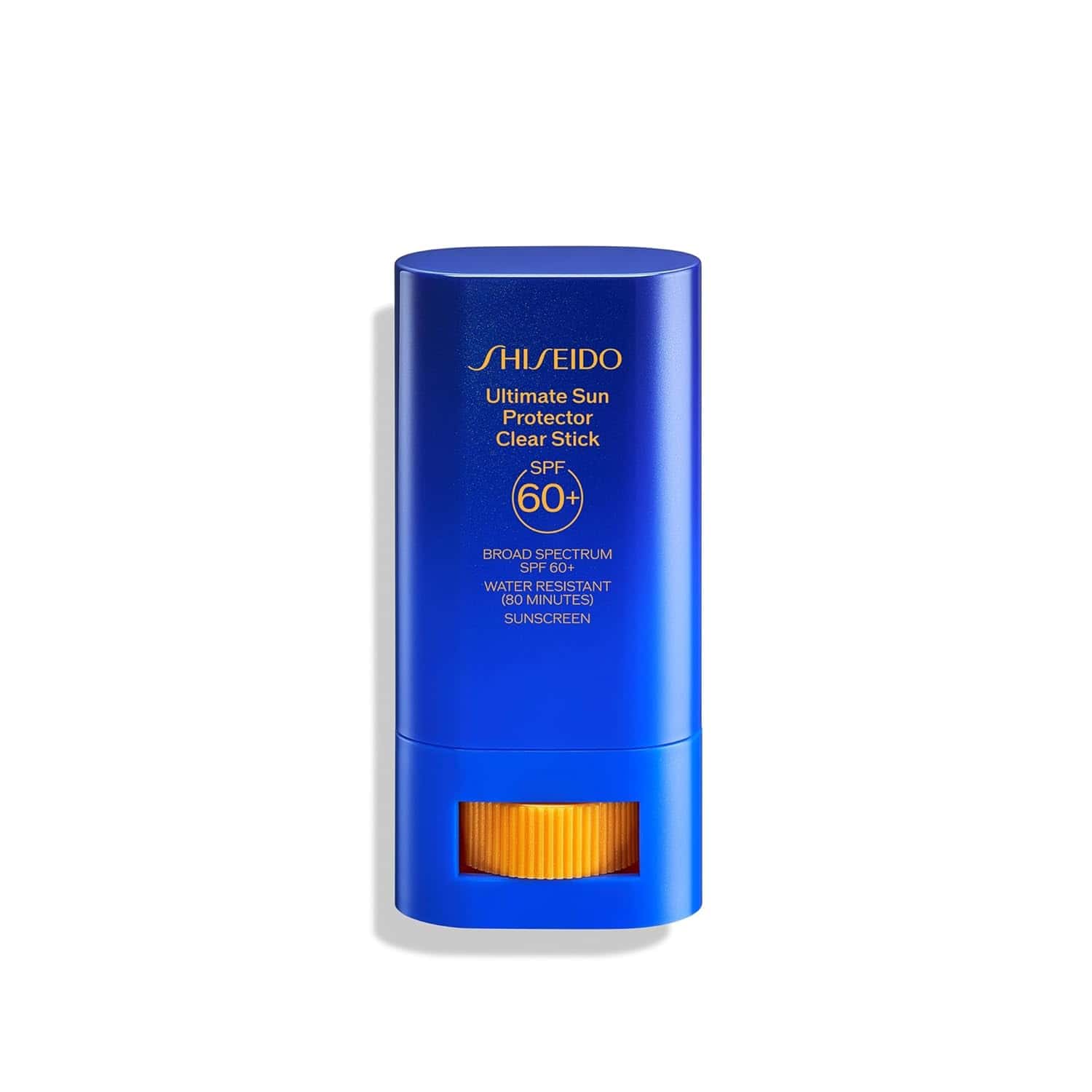 A blue Shiseido Ultimate Sun Protector Clear Stick SPF 60+ sunscreen container with a yellow swivel base, photographed on a white background.