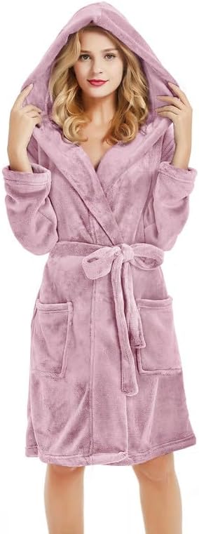 A woman wearing a light purple hooded fleece bathrobe with front pockets and a waist belt, standing and facing forward.