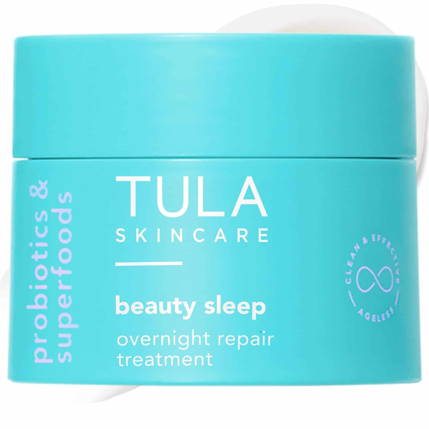 A turquoise jar of Tula Skincare beauty sleep overnight repair treatment with probiotics and superfoods, featuring clean and effective branding.