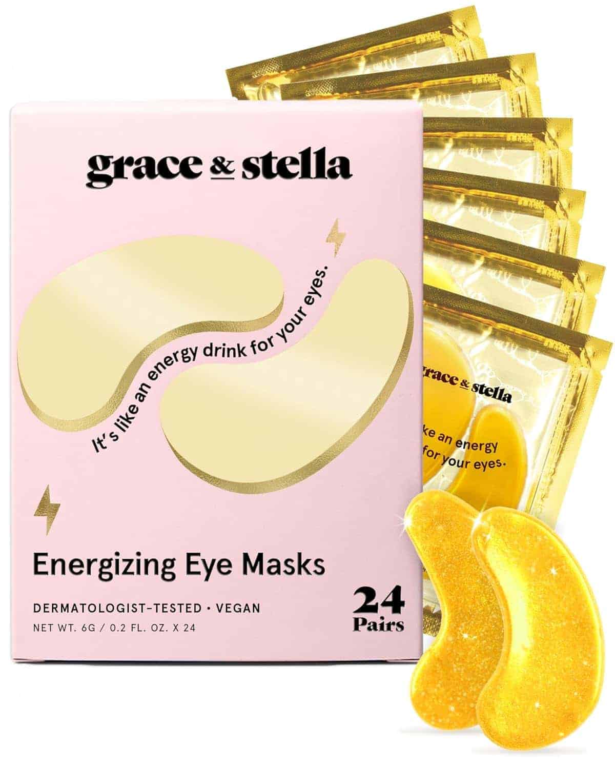 A box of Grace & Stella Energizing Eye Masks is shown with several gold foil packets and two gold-colored eye masks displayed in front.