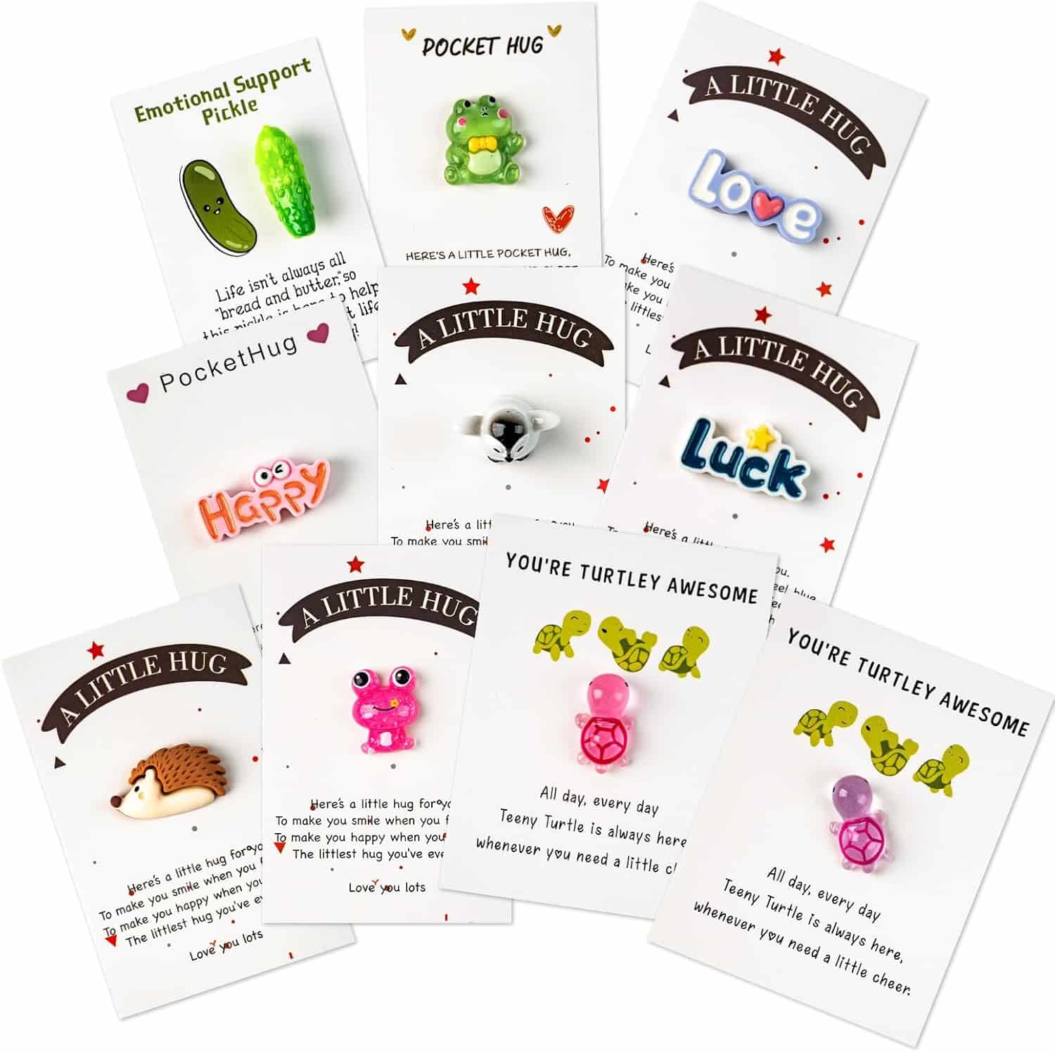 A collection of small novelty pins with various designs (animals, words, objects) attached to cards featuring supportive and encouraging messages.