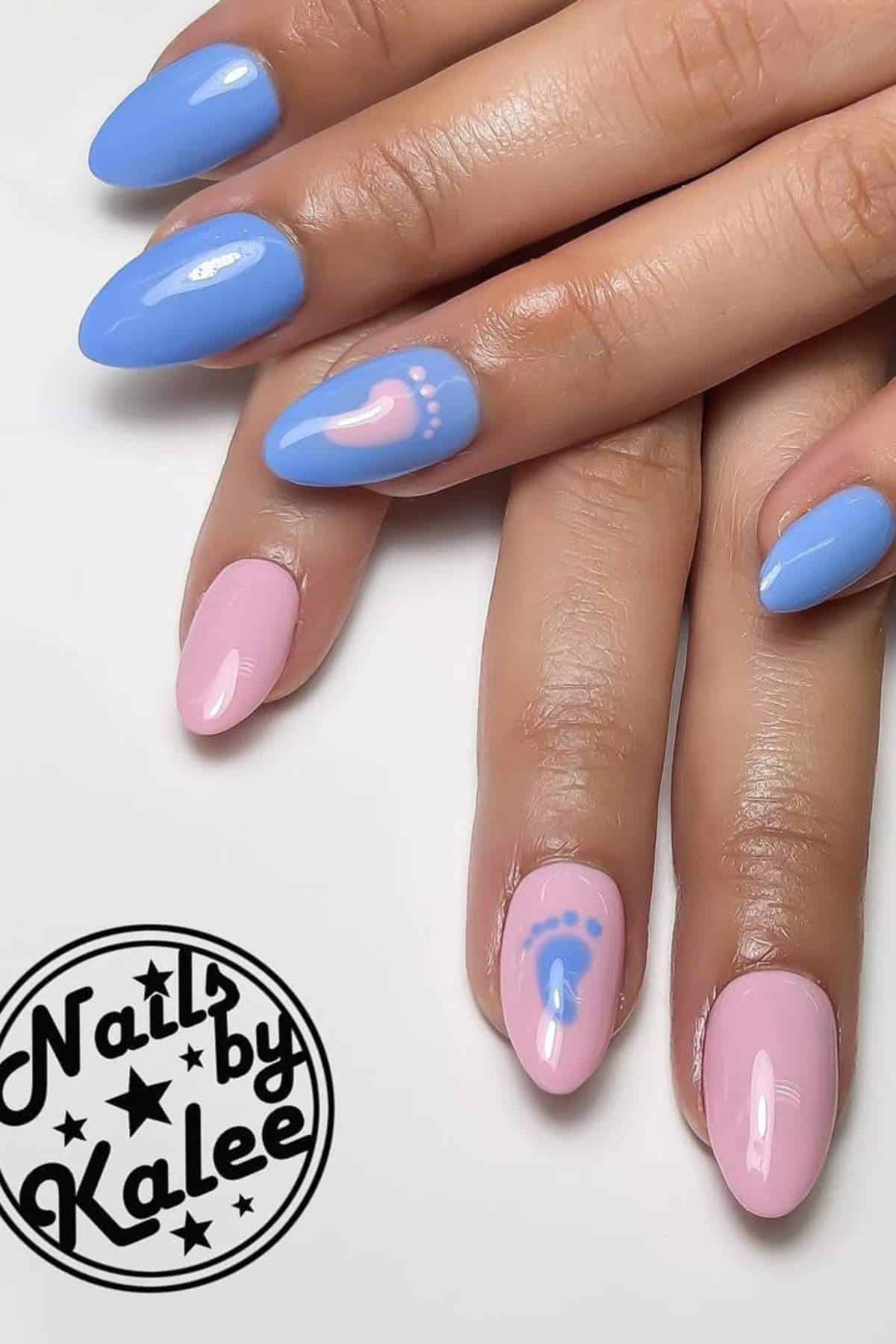 Hands with pink and blue manicured nails, featuring baby footprints and dot designs, with "Nails by Kalee" logo in the corner.